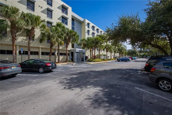 a view of a cars parked in front of a building