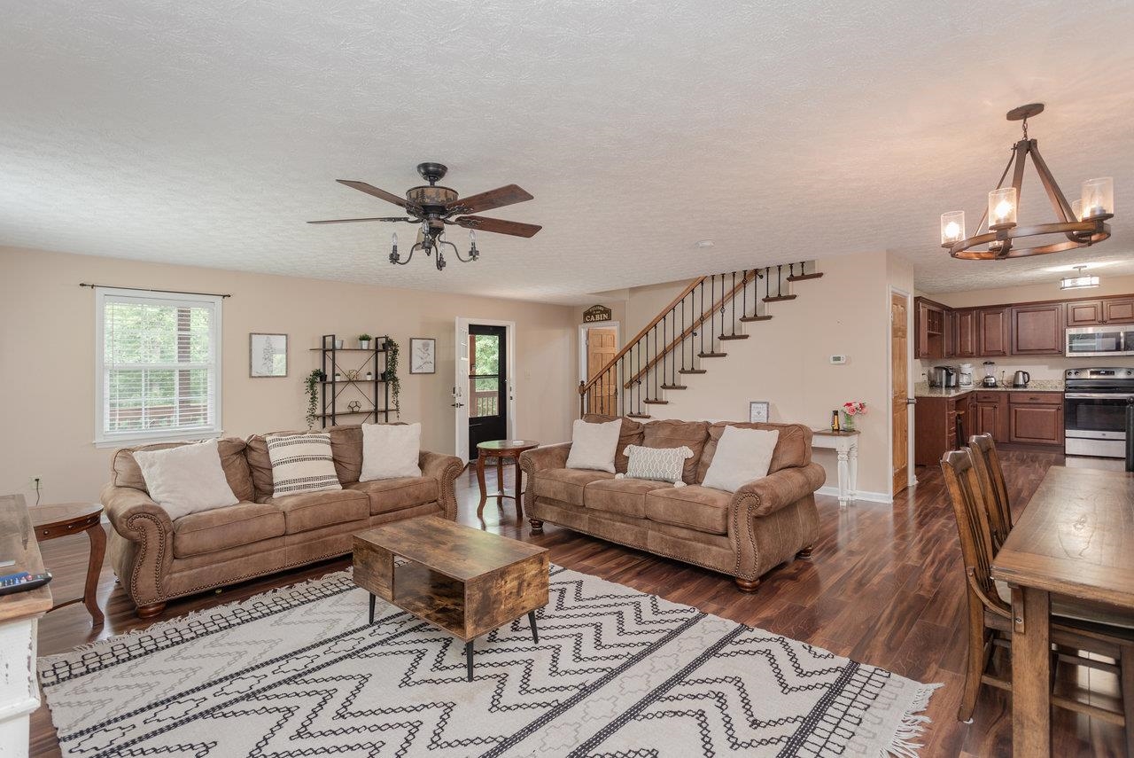 159 Park View Shenandoah, VA 22849 - Photo 8 of 70 a living room with furniture a fireplace and a chandelier
