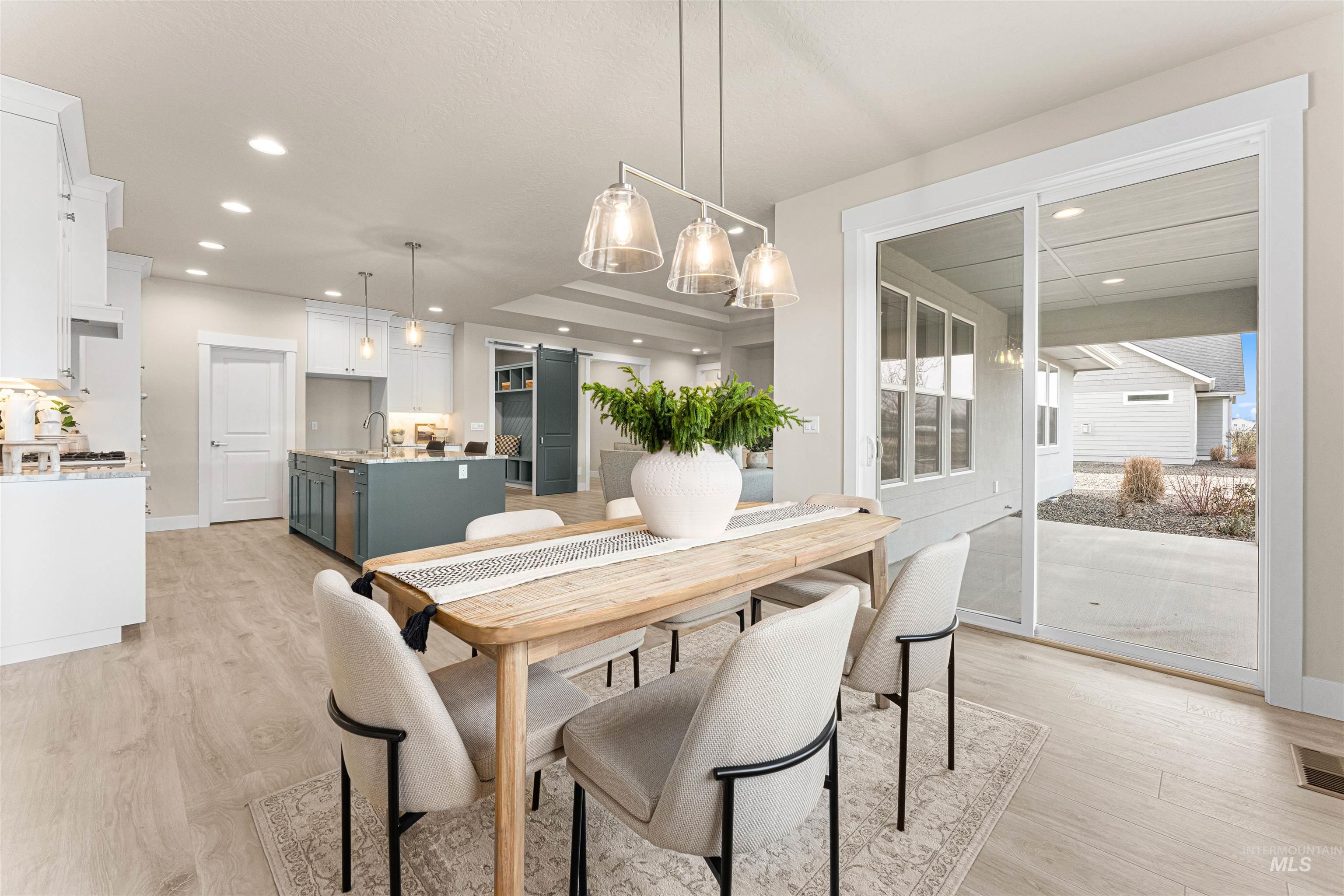 8078 Tandy Cv Street Middleton, ID 83644 - Photo 17 of 40 Dining room featuring light wood-style floors and recessed lighting