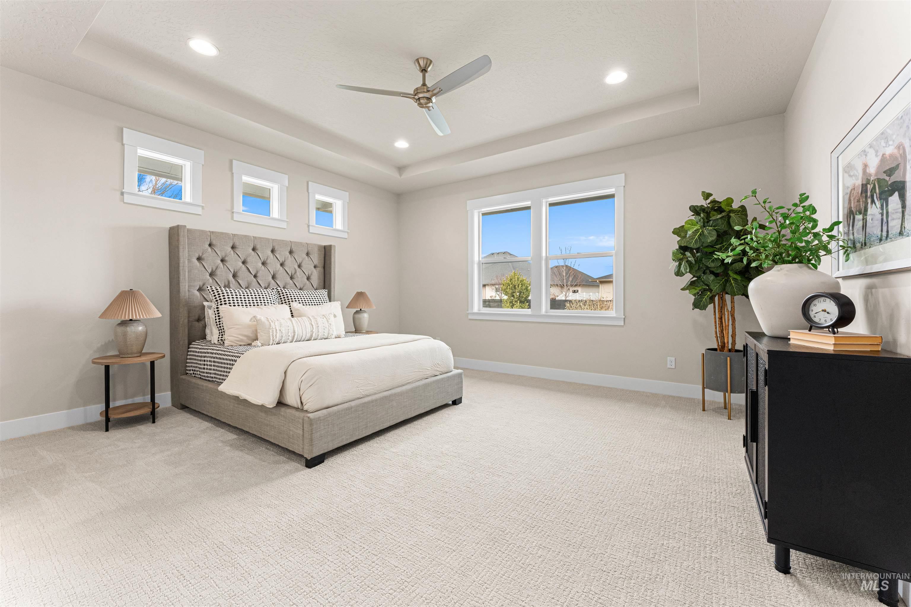 8078 Tandy Cv Street Middleton, ID 83644 - Photo 19 of 40 Bedroom featuring light colored carpet, recessed lighting, a ceiling fan, and a tray ceiling