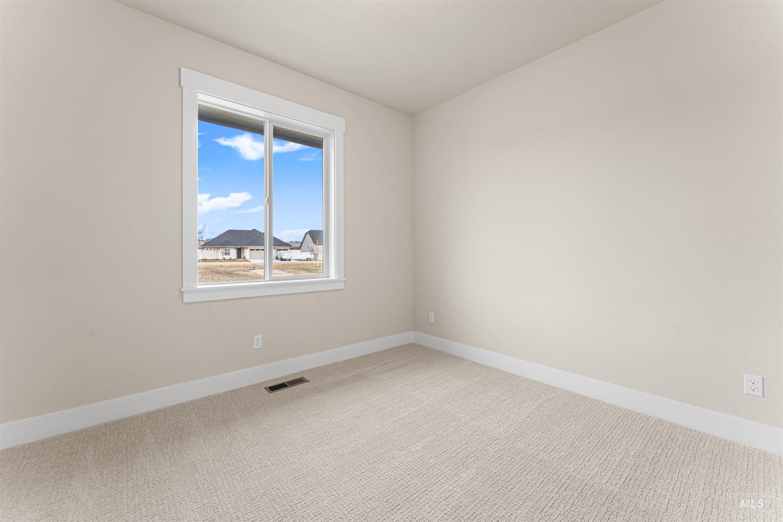 8078 Tandy Cv Street Middleton, ID 83644 - Photo 29 of 40 Carpeted empty room featuring baseboards