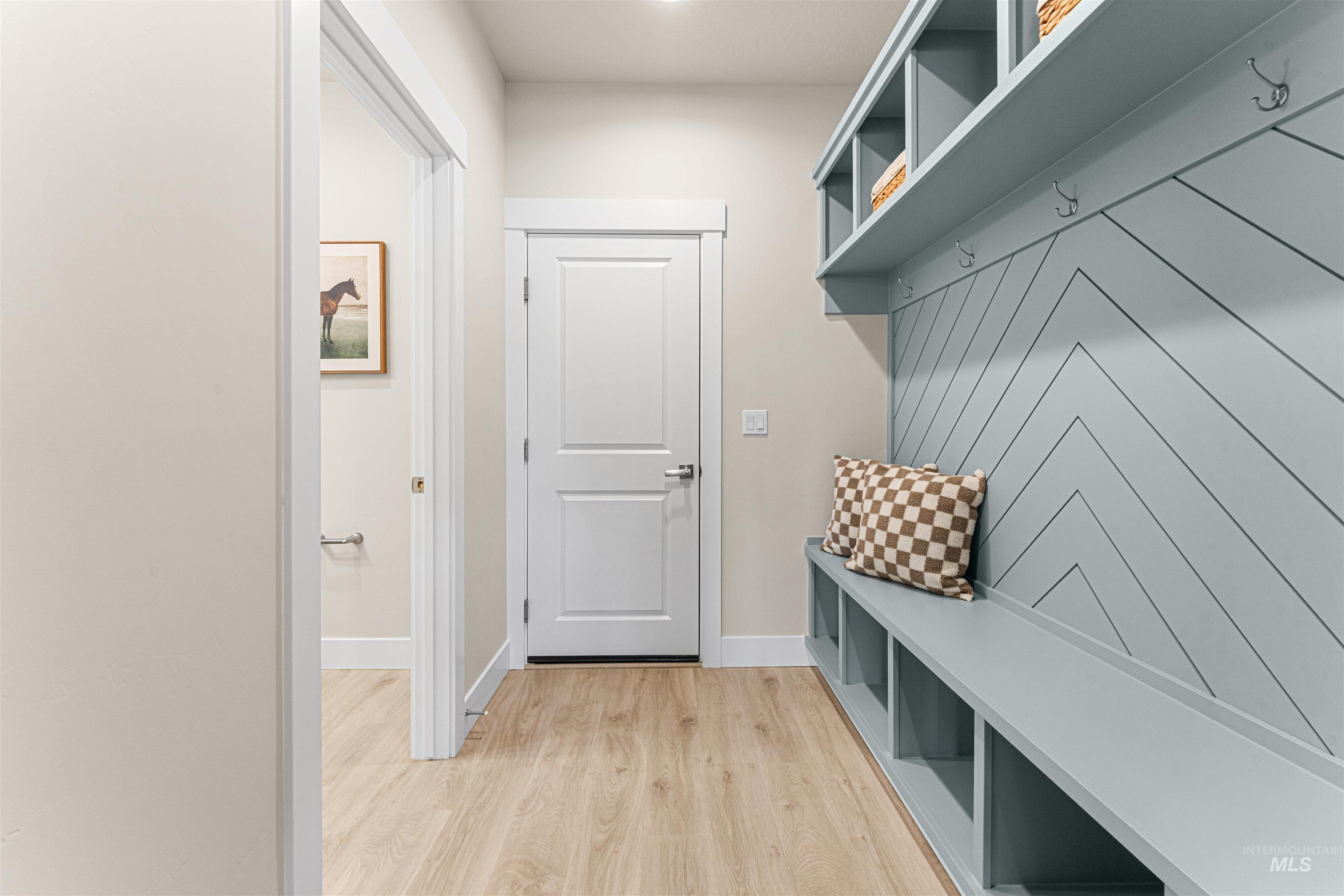 8078 Tandy Cv Street Middleton, ID 83644 - Photo 34 of 40 Mudroom featuring light wood-style floors and baseboards
