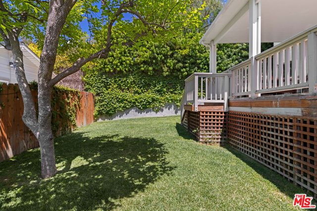 a yellow house with a outdoor space