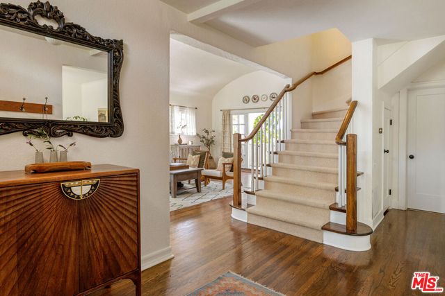 a living room with furniture a window and a fireplace