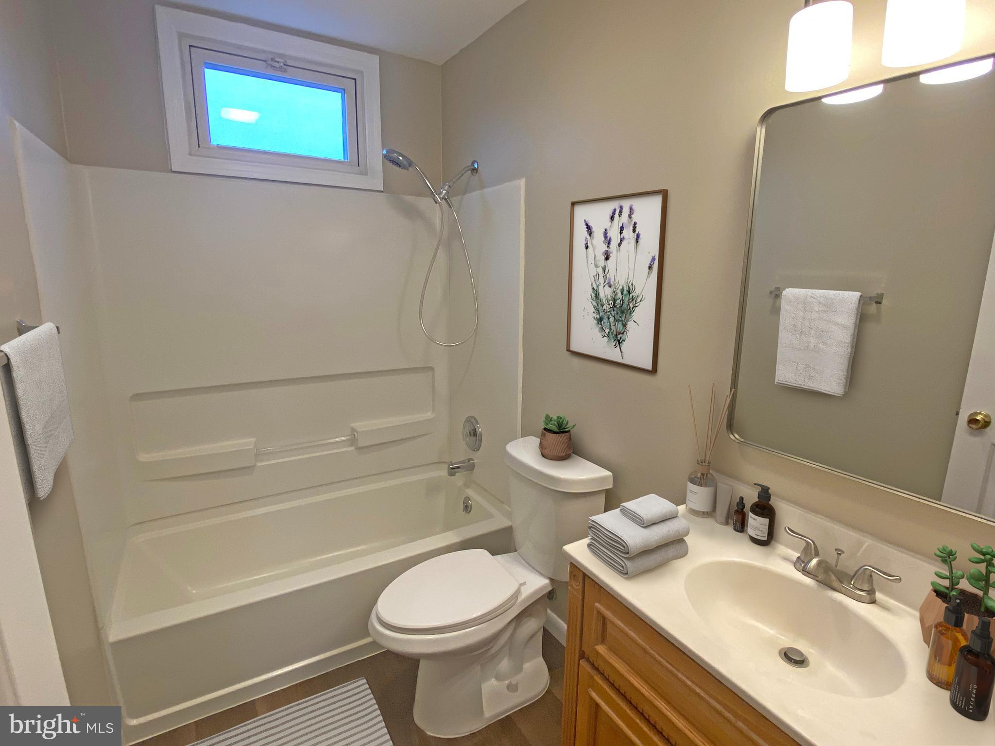 21 Merion Road Newark, DE 19713 - Photo 21 of 28 a bathroom with a sink toilet and shower