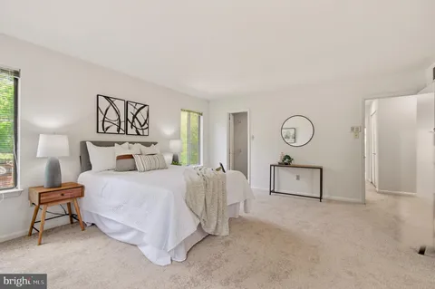 a bathroom with a sink a vanity and shower