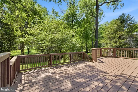 a view of a deck with a wooden fence