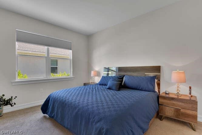 1064 Tranquil Brook Drive Naples, FL 34114 - Photo 15 of 28 a bedroom with a bed and window