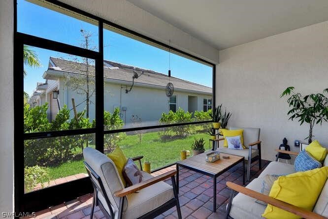 1064 Tranquil Brook Drive Naples, FL 34114 - Photo 22 of 28 a view of a outdoor seating area
