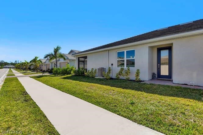 1064 Tranquil Brook Drive Naples, FL 34114 - Photo 23 of 28 a view of a house with backyard and garden