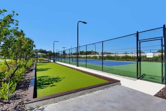1064 Tranquil Brook Drive Naples, FL 34114 - Photo 25 of 28 a view of a backyard with swimming pool