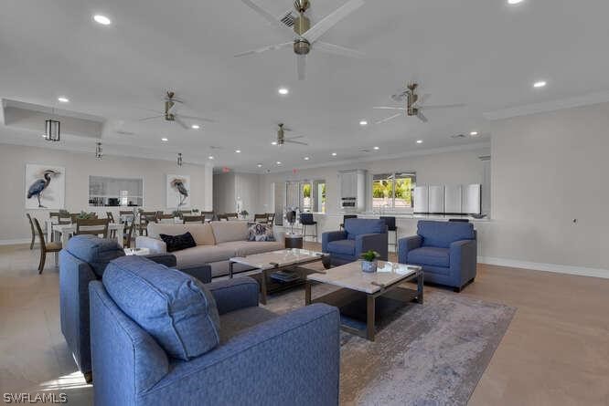 1064 Tranquil Brook Drive Naples, FL 34114 - Photo 27 of 28 a living room with lots of furniture and a chandelier