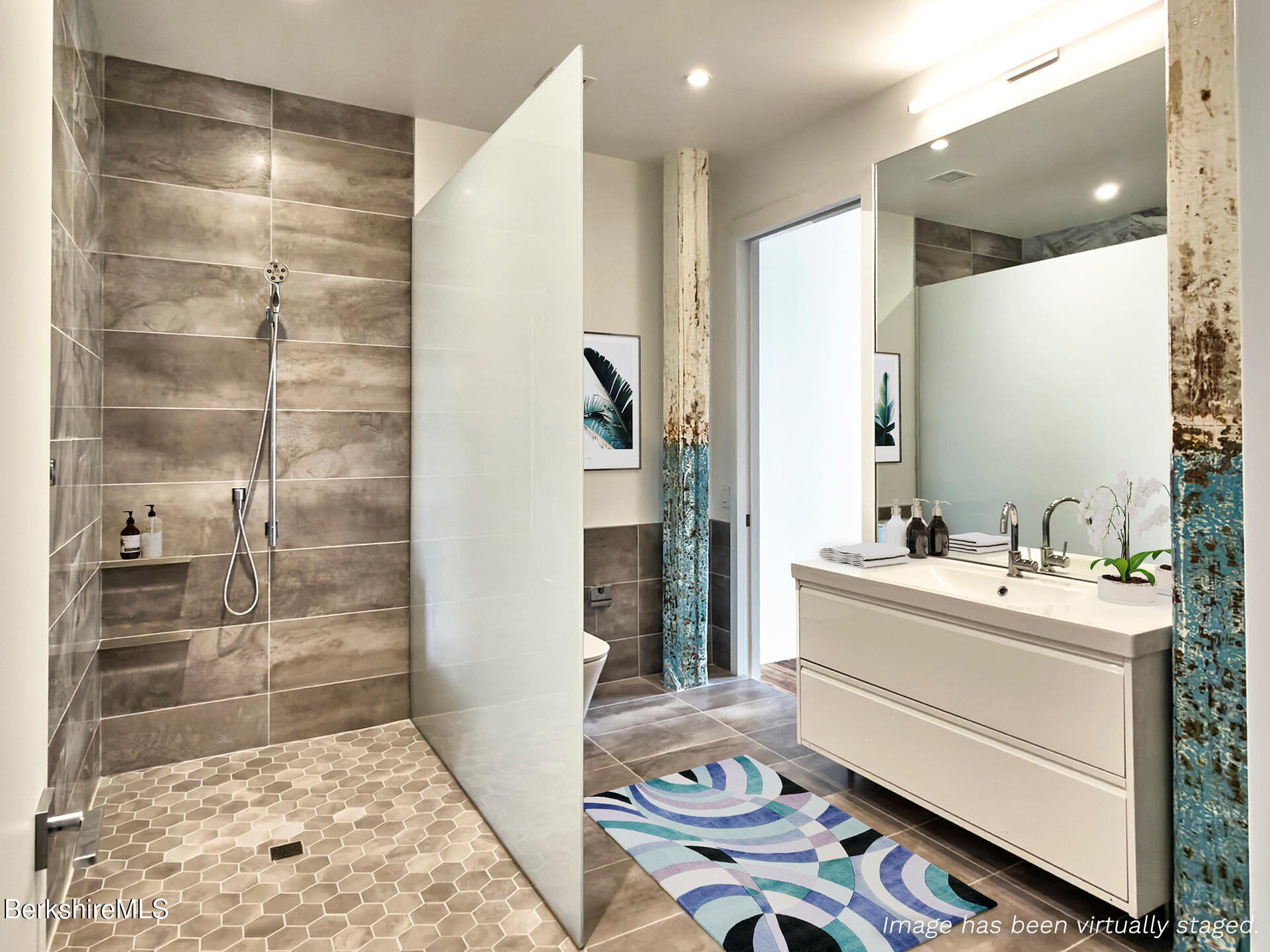 520 State Road, Unit 208 North Adams, MA 01247 - Photo 14 of 38 a bathroom with a sink a mirror and a shower