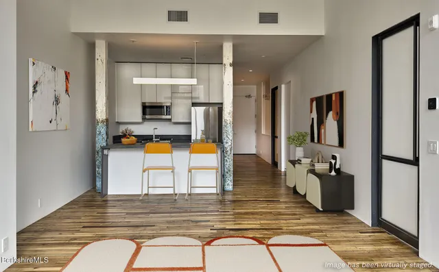 a view of living room filled with furniture and window