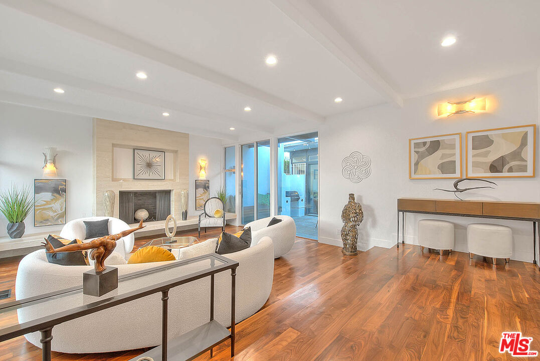 3804 Duray Place Los Angeles, CA 90008 - Photo 14 of 73 a living room with furniture a fireplace and a table