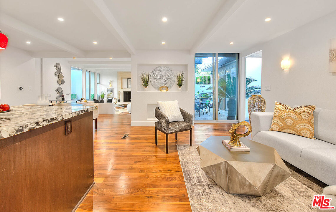 3804 Duray Place Los Angeles, CA 90008 - Photo 18 of 73 a living room with fireplace furniture and a table