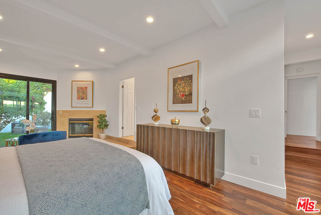 3804 Duray Place Los Angeles, CA 90008 - Photo 36 of 73 a bed room with furniture and a fireplace