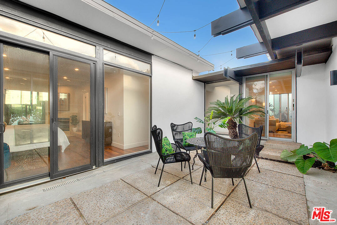 3804 Duray Place Los Angeles, CA 90008 - Photo 50 of 73 a dining room with furniture and potted plants