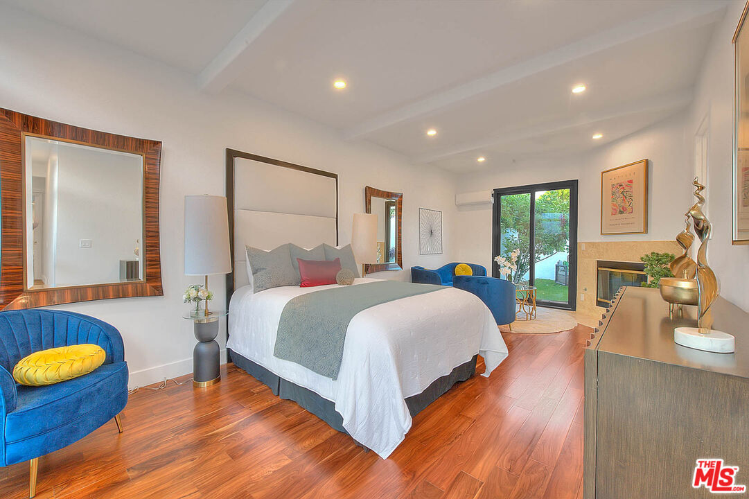 3804 Duray Place Los Angeles, CA 90008 - Photo 54 of 73 a spacious bedroom with a bed and a couch