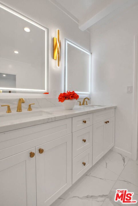 3804 Duray Place Los Angeles, CA 90008 - Photo 62 of 73 a bathroom with a sink and a mirror