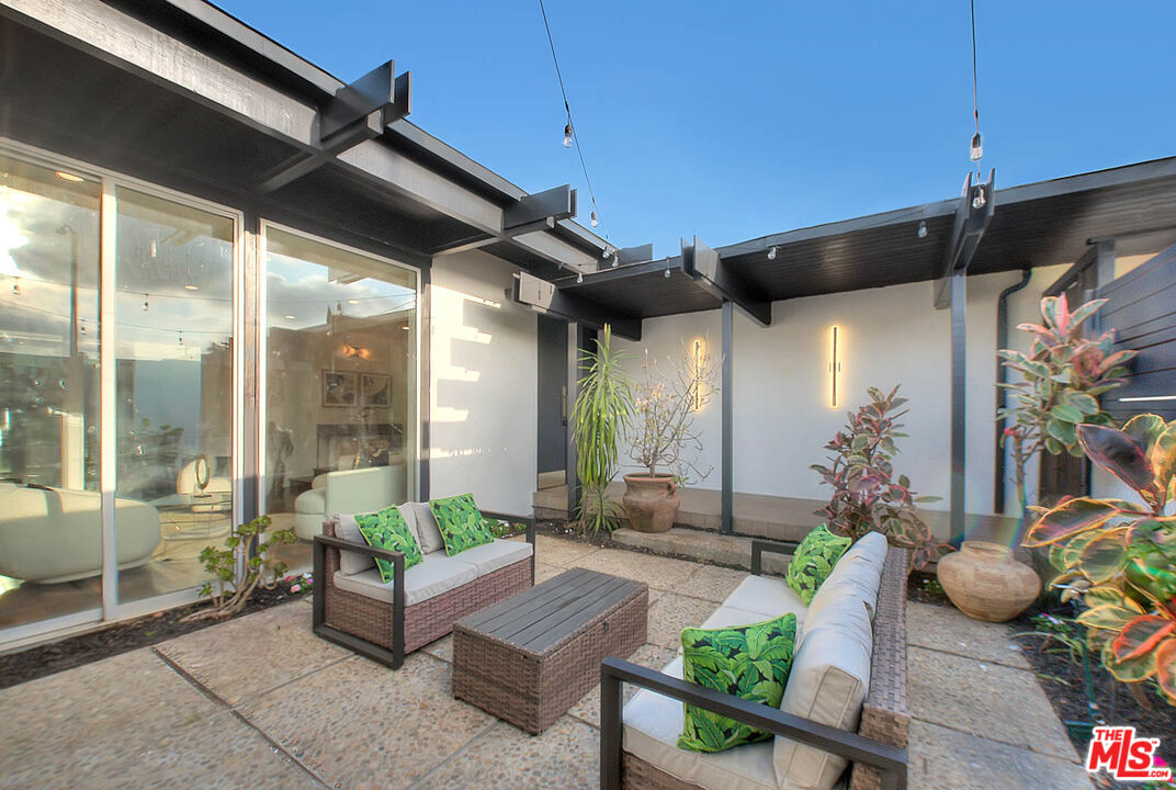 3804 Duray Place Los Angeles, CA 90008 - Photo 7 of 73 a view of a patio with couches table and chairs and potted plants