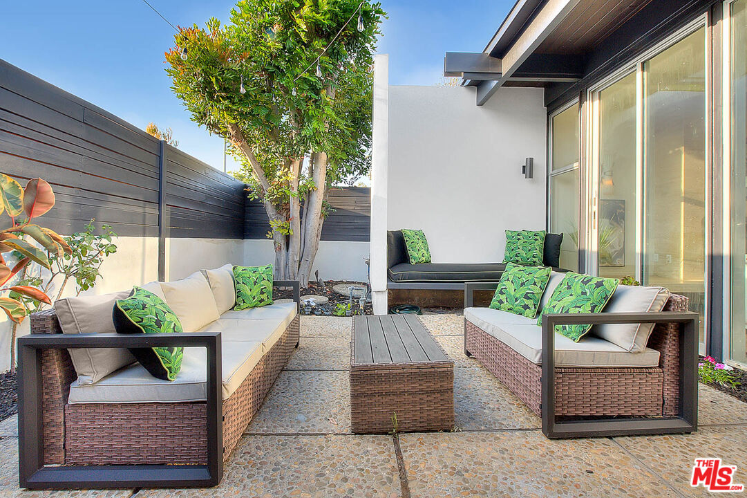 3804 Duray Place Los Angeles, CA 90008 - Photo 10 of 73 a living room with furniture and a potted plant
