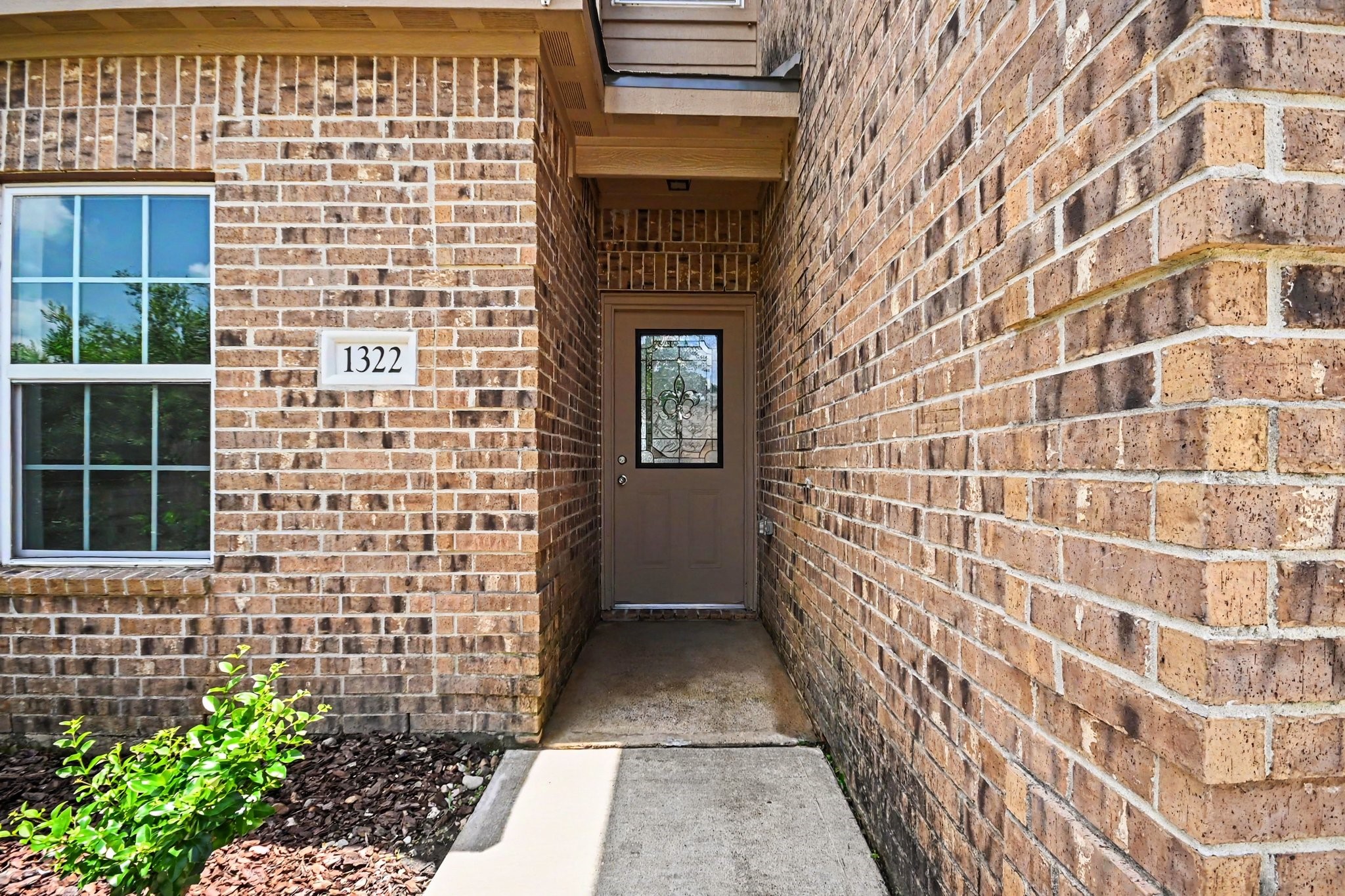1322 Diamond Drape Drive Rosharon, TX 77583 - Photo 3 of 45 a view of a brick house with a door
