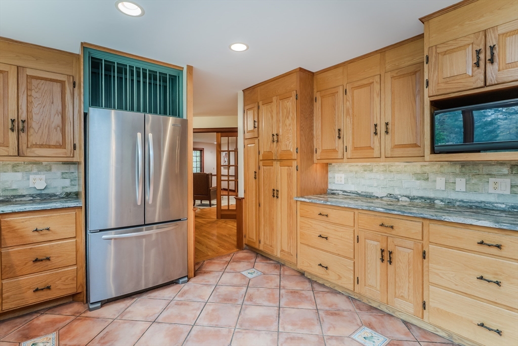 71 Mathews Road South Deerfield, MA 01373 - Photo 13 of 42 a kitchen with granite countertop a refrigerator sink and cabinets