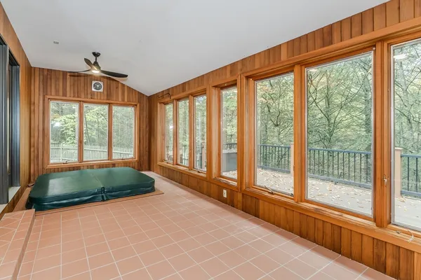 a spacious bedroom with a large bed and a large window