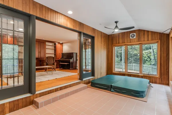 a bedroom with furniture and large windows