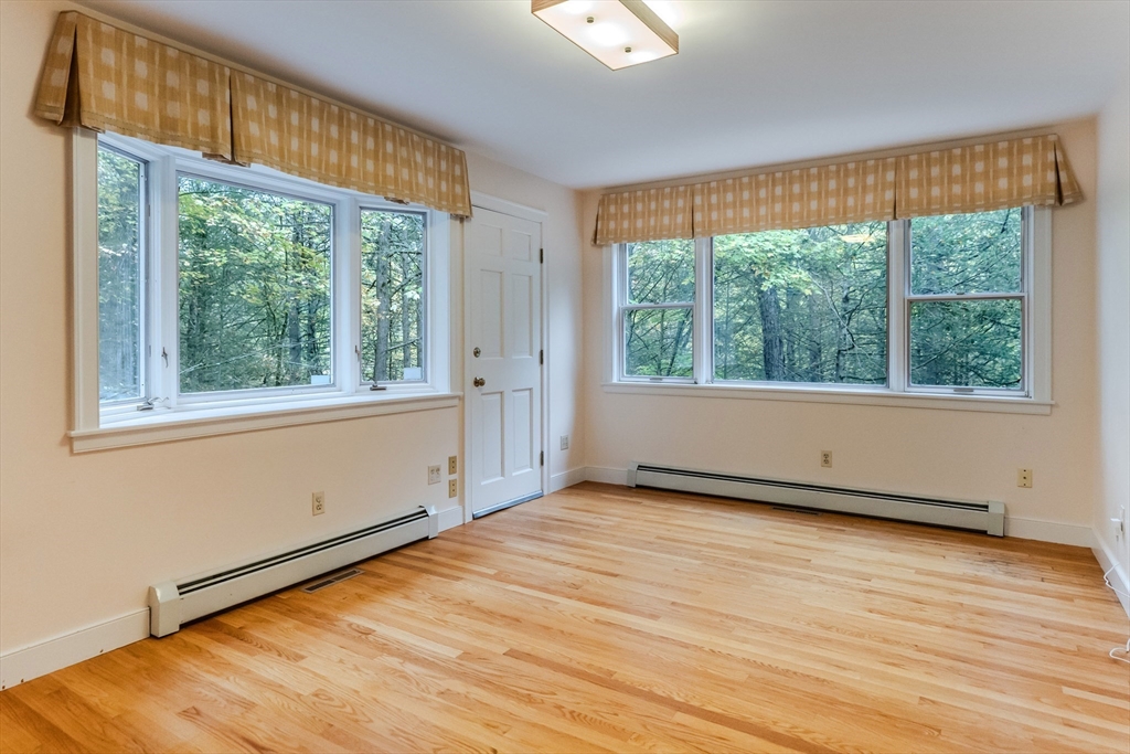 71 Mathews Road South Deerfield, MA 01373 - Photo 21 of 42 a view of an empty room with wooden floor and a window
