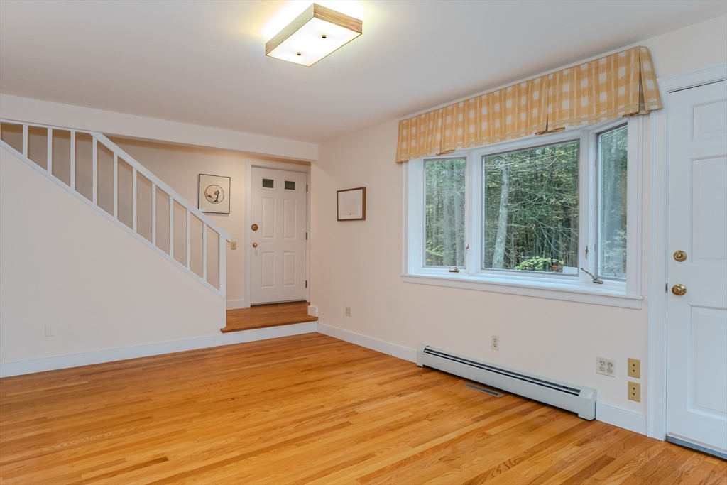 71 Mathews Road South Deerfield, MA 01373 - Photo 22 of 42 a view of an empty room with wooden floor and a window