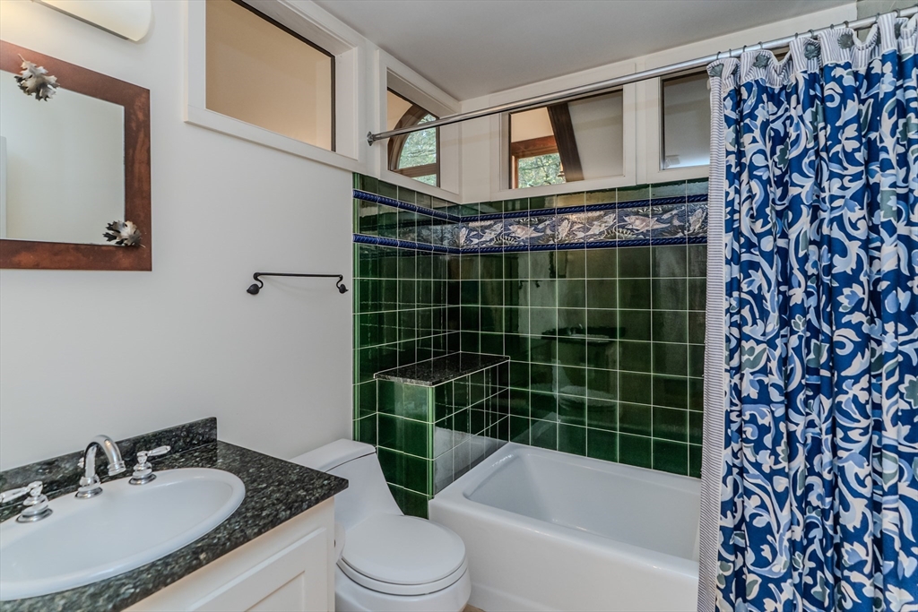 71 Mathews Road South Deerfield, MA 01373 - Photo 26 of 42 a bathroom with a granite countertop bathtub sink vanity mirror and toilet