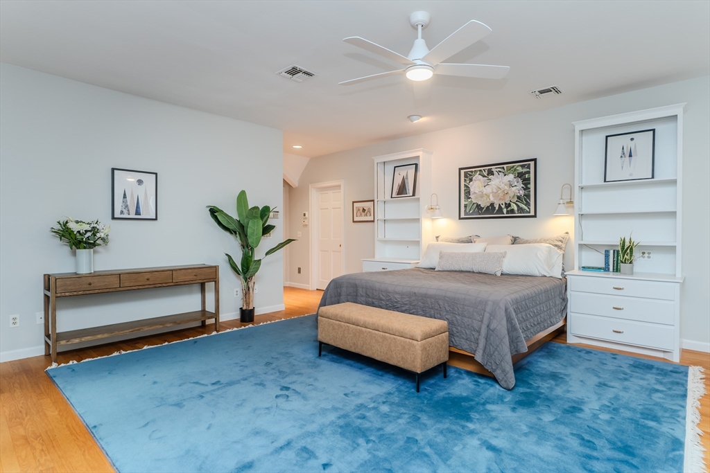 71 Mathews Road South Deerfield, MA 01373 - Photo 32 of 42 a spacious bedroom with a bed and a chandelier