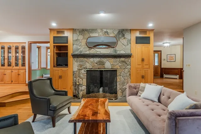 a living room with furniture and a fireplace