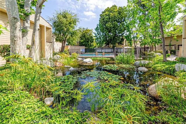 a view of yard with swimming pool and sitting area
