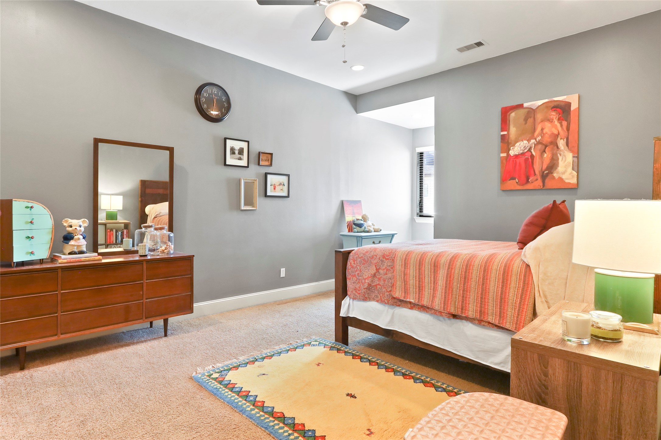 1905 Summer Street Houston, TX 77007 - Photo 16 of 25 a bedroom with a bed and a chandelier