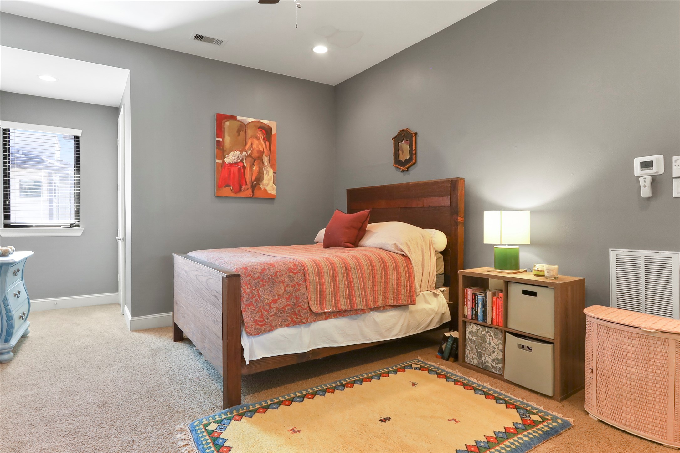 1905 Summer Street Houston, TX 77007 - Photo 17 of 25 a bedroom with a bed and a dresser