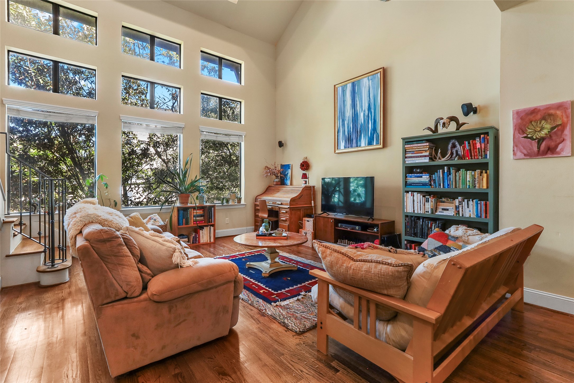 1905 Summer Street Houston, TX 77007 - Photo 2 of 25 a living room with fireplace furniture and a book shelf
