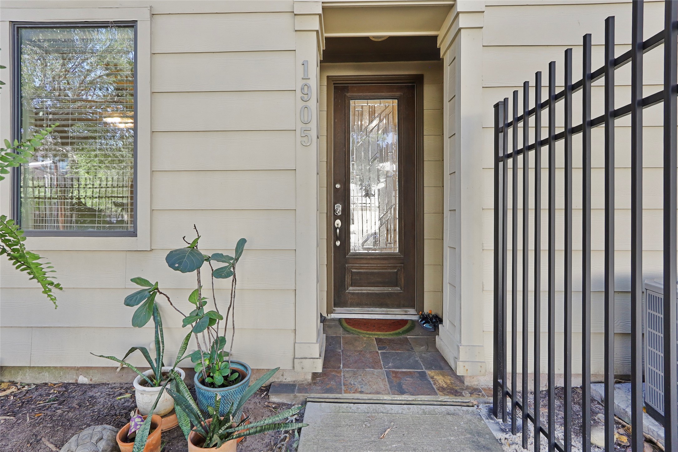 1905 Summer Street Houston, TX 77007 - Photo 23 of 25 a potted plant sitting in front of a door