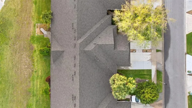 a backyard of a house with outdoor seating