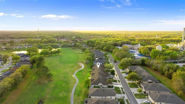 an aerial view of residential houses with outdoor space