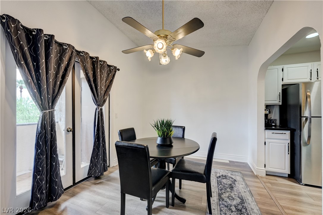 1751 East Reno Avenue, Unit 228 Las Vegas, NV 89119 - Photo 10 of 39 Dining area with contemporary finishes adjoins the kitchen, complete with a ceiling fan for comfort.
