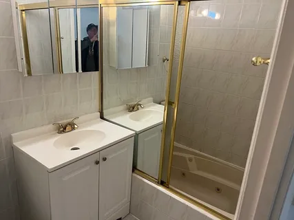 a bathroom with a sink and mirror