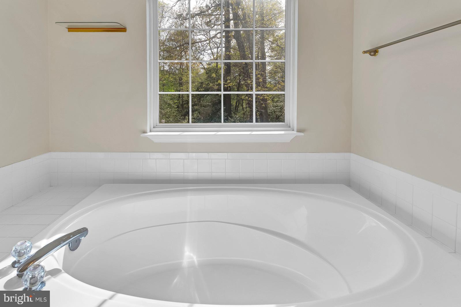 6815 Mackall Road St. Leonard, MD 20685 - Photo 20 of 38 a view of a bathtub in a bathroom