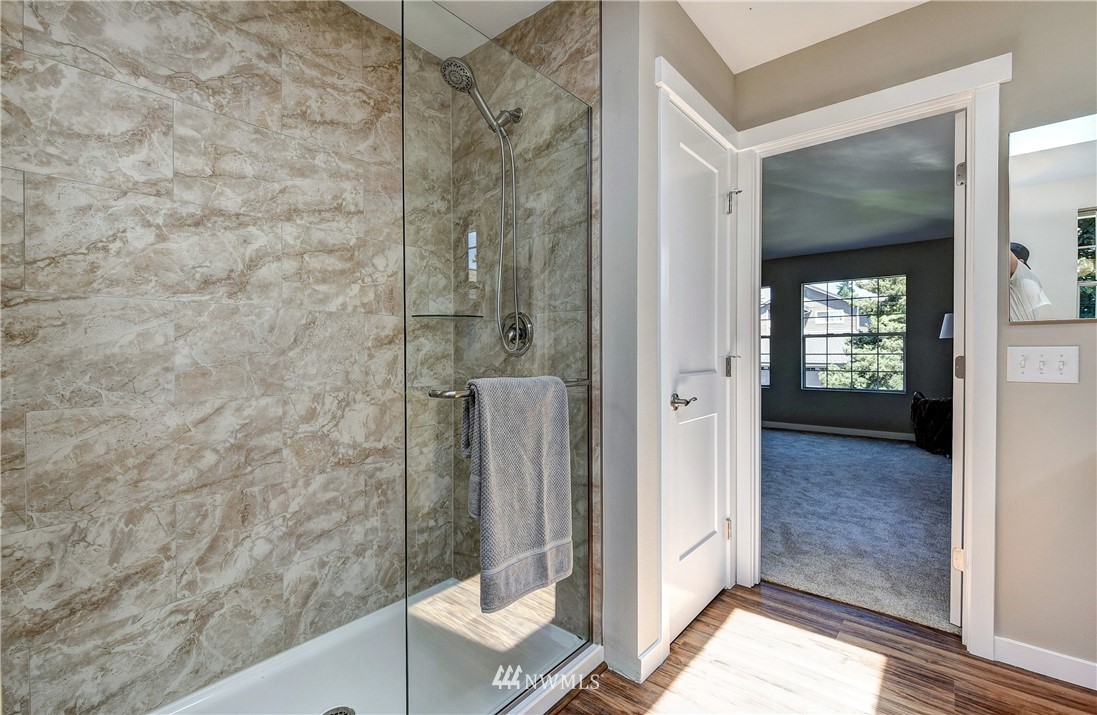 224 239th Street Southwest Bothell, WA 98021 - Photo 22 of 34 a bathroom with a shower and a sink
