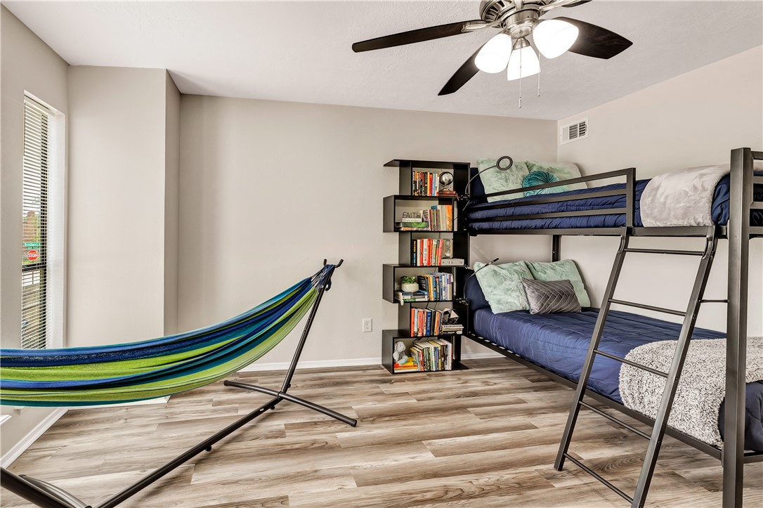 1516 Hawk Tree Drive, Unit C College Station, TX 77845 - Photo 14 of 15 a room with furniture and wooden floor