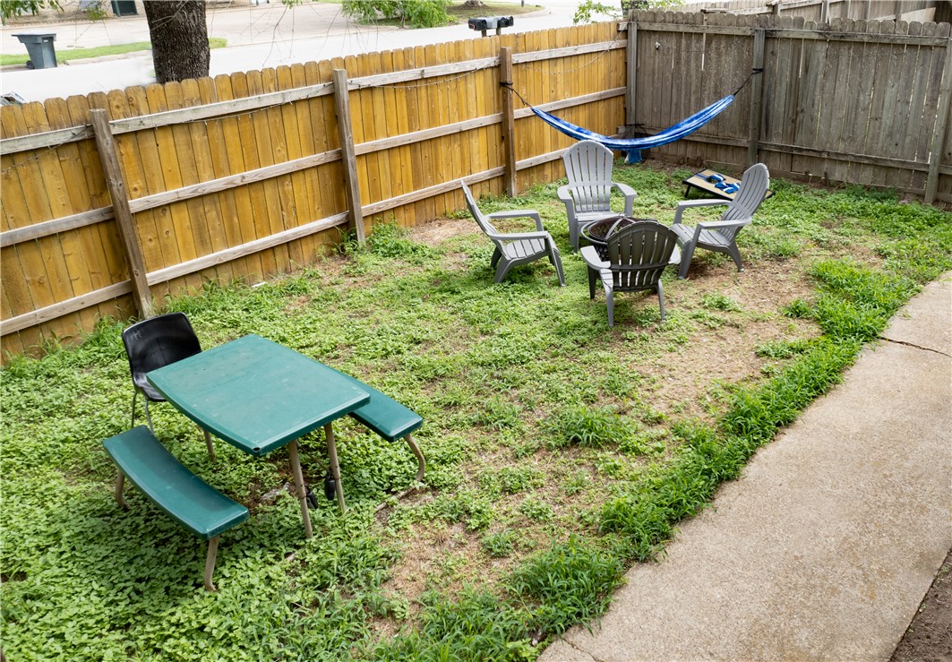 1516 Hawk Tree Drive, Unit C College Station, TX 77845 - Photo 15 of 15 a backyard of a house with table and chairs