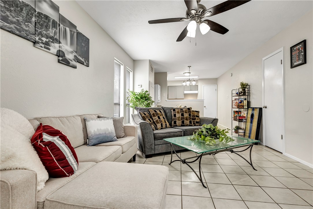 1516 Hawk Tree Drive, Unit C College Station, TX 77845 - Photo 2 of 15 a living room with furniture and a ceiling fan