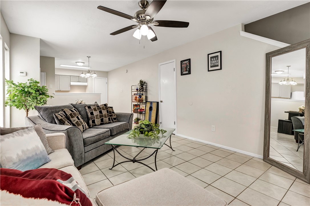 1516 Hawk Tree Drive, Unit C College Station, TX 77845 - Photo 3 of 15 a living room with furniture and a chandelier